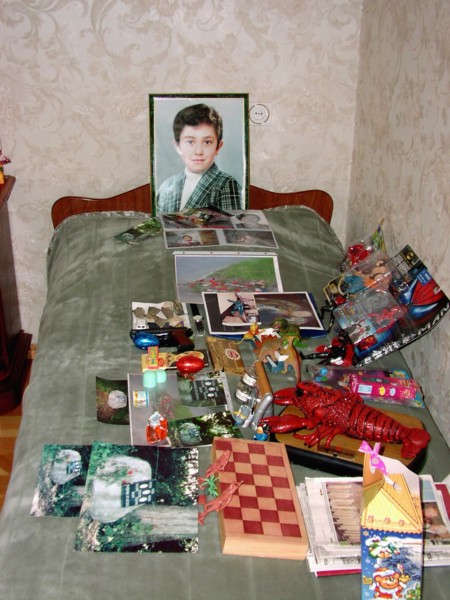 The portrait, bed and toys of a 10-year-old kostya - the son of a construction engineer vitaly kaloyev, who is suspected of the murder of a swiss air traffic controller peter nielsen, north ossetia, r...