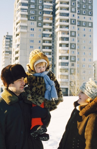 Young teachers with their child outside of new accomdations in chelyabinsk, russia.