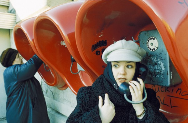 Fashionable young woman at the public phones in lipetsk which have been free since 1996, april 2001.