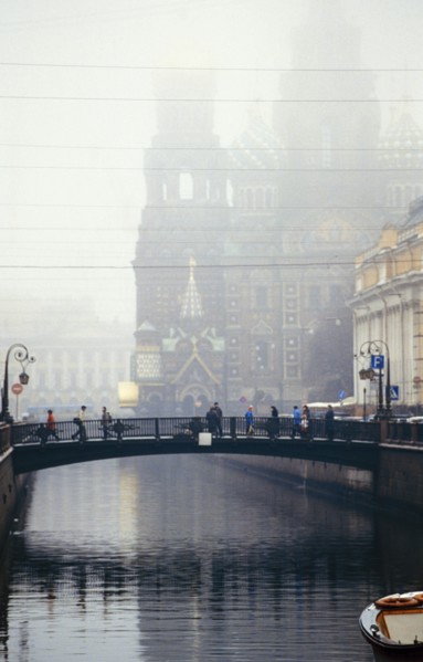 Italian bridge over st, catherine's canal in st, petersburg, russia on a foggy day, 1999, the church of our savior on the spilled blood is beyond.