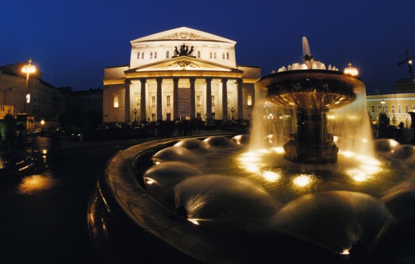 Fountain outside of the bolshoi theater lit up at night in moscow, 2000s.