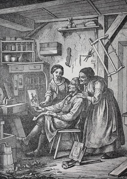 Family Looks At The Image Of The Son At Home
