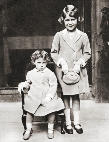 Princess Elizabeth of York and her younger sister Princess Margaret with gifts presented to them by members of the Disabled Soldier's Embroidery Society in 1933