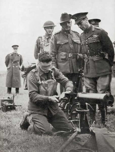 King George VI watching a blindfolded Australian soldier assemble a machine gun