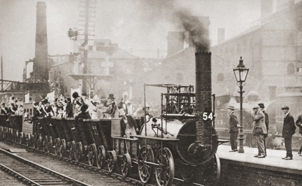 George Stephenson's railway engine making the journey from Stockton to Darlington in 1925 to mark its hundred years anniversary of the first journey in 1825.  From These Tremendous Years