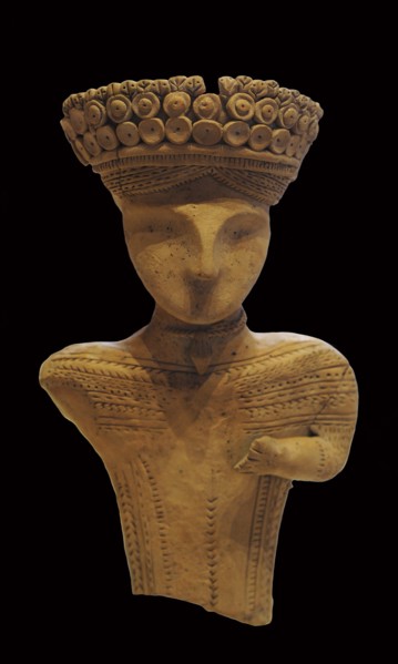 Terracotta female figure with rosette headband, necklace and tunic, 4th-3rd century BC