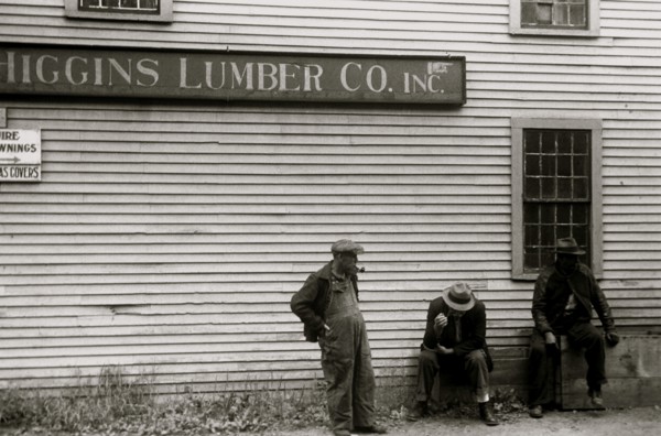 African American sit by the side of  Lumberyard in Provincetown, Mass.