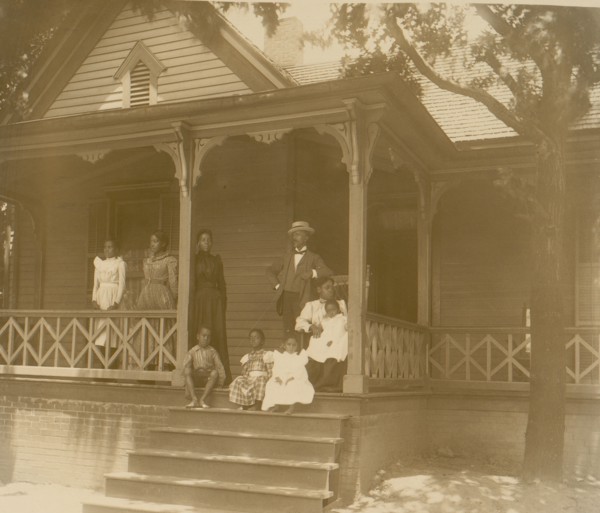 Home of an African American lawyer, Atlanta, Georgia, with men, women, and children posed on porch of house