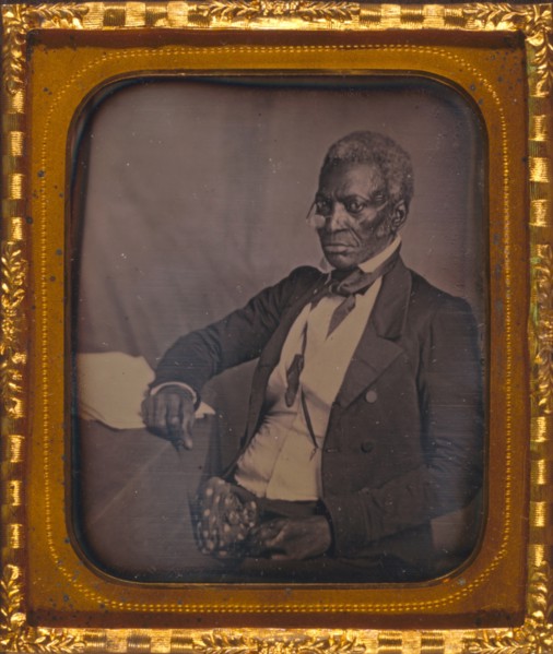 John Hanson, three-quarter length portrait, three-quarters view, wearing glasses, seated at desk