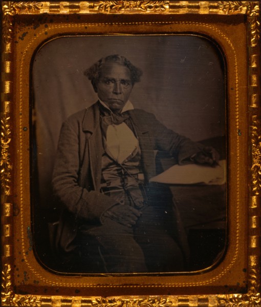 Edward Morris, three-quarter length portrait, full face, seated at desk