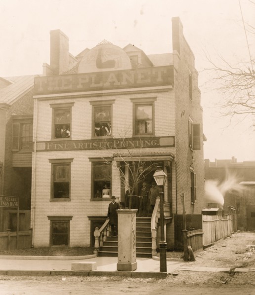 People posed on porch of and in the Planet newspaper publishing house, Richmond, Virginia