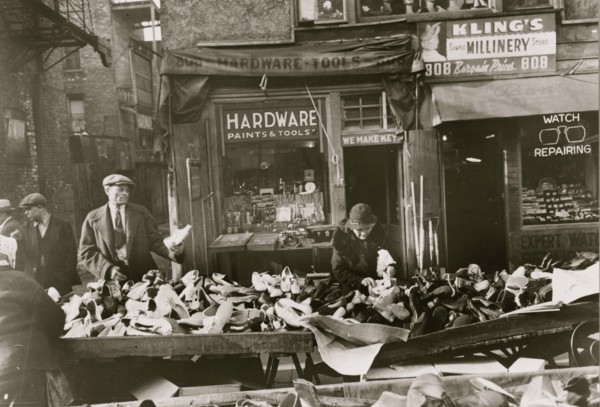 People shopping for shoes at shop on Maxwell Street, Chicago, Illinois