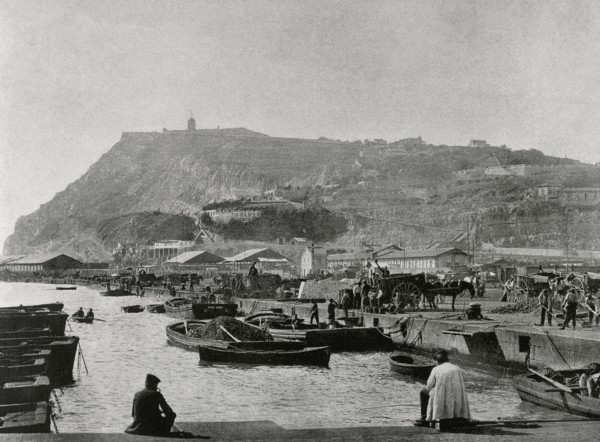 Coal's pier and Montjuic's Mountain in the background.