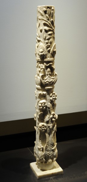 Roman column with flowering branches, swans with deployed wings, dolphins, baskets of fruit, theater masks and olive branches.