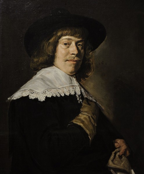 A Young Man Holding a Glove.