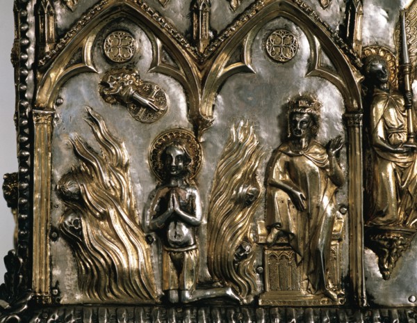 Reliquary casket of Saint Cucuphas. Wooden gilded silver. 14th Century. Detail. Saint Cucuphas in a bonfire from where demons are fleeing. Over the Saint, the Hand of God (dextera domini) while Maximi...