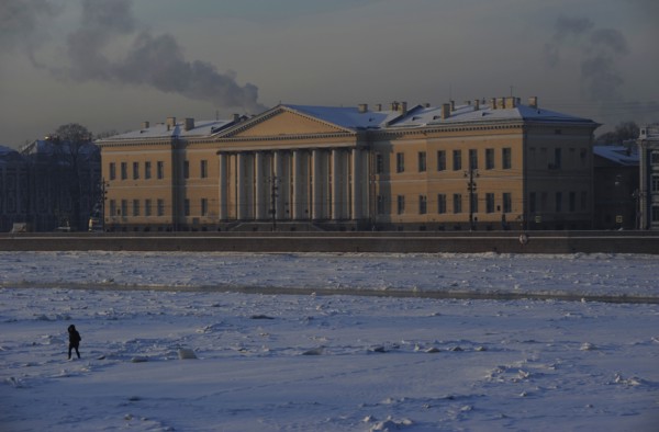 Person walking on the frozen Neva river during the winter surface.