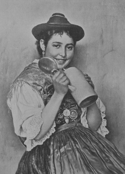 Bavarian woman wearing traditional dress and holding a beer mug
