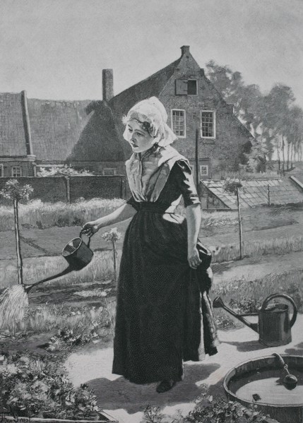 Girl watering in the home garden