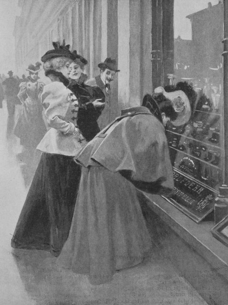 Women are standing in front of the window of a jeweler and are looking for Christmas wishes