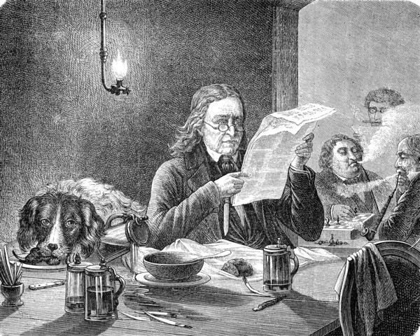 While the man is reading in the newspaper