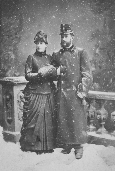 Couple stands in the snow