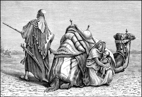 Bedouin family with camel in the Arabian desert