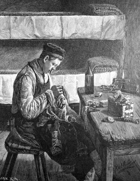 Soldier preparing uniform for roll call