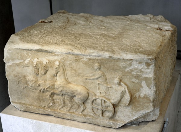 Base of a dedication. Scene from the apobates race.
