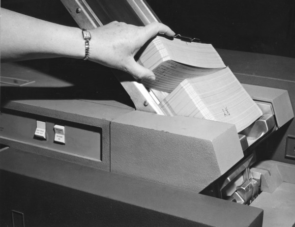Punched Data Cards Fed Into Processor