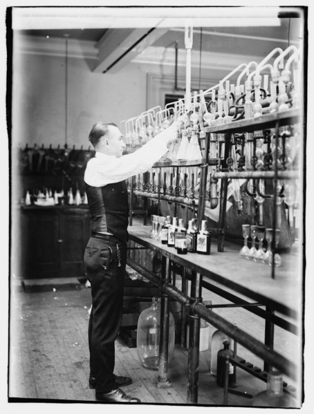 1920 -  Treasury, Internal Rev. Chemist G.F. Beyertesting bootleggers' booze.