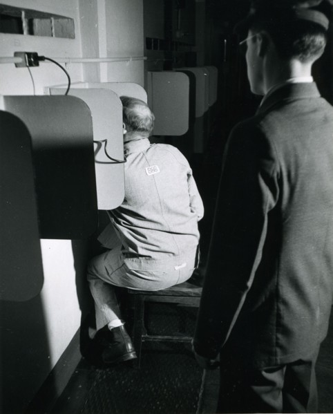 Alcatraz prisoner making a phone call. Alcatraz Prison, San Francisco, 1950's