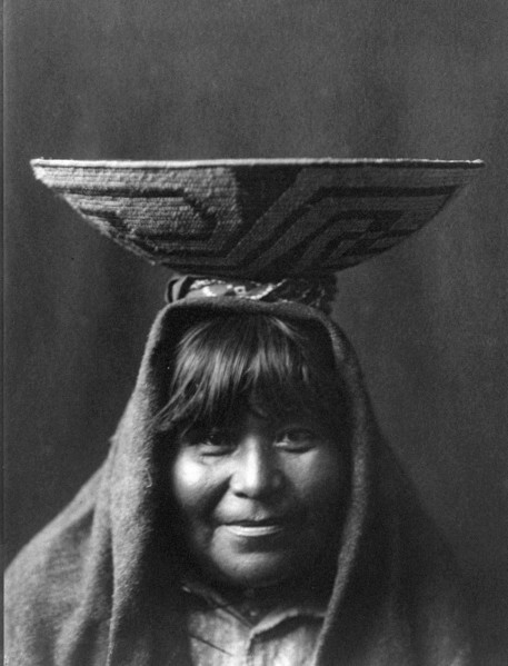 Edward S. Curtis Native American Indians - Pima Indian woman with bowl on her head circa 1907.