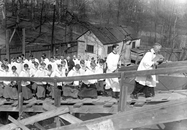 Catholic clergy and priests at outdoor religious service circa 1918.