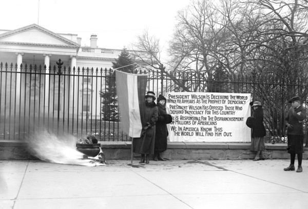 Woman Suffrage Movement - Bonfire on the sidewalk in front of the White House circa 1918 .