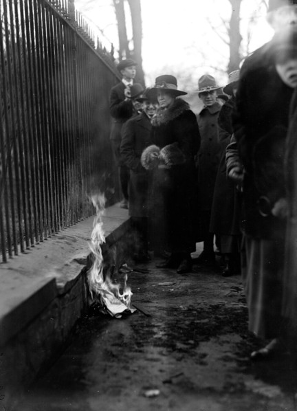 Woman Suffrage Movement - Bonfire on the sidewalk in front of the White House circa 1918 .
