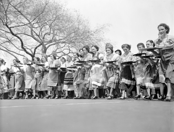 First annual waitresses derby in Washington D.C., waitresses carrying cocktail setups  circa 1937.