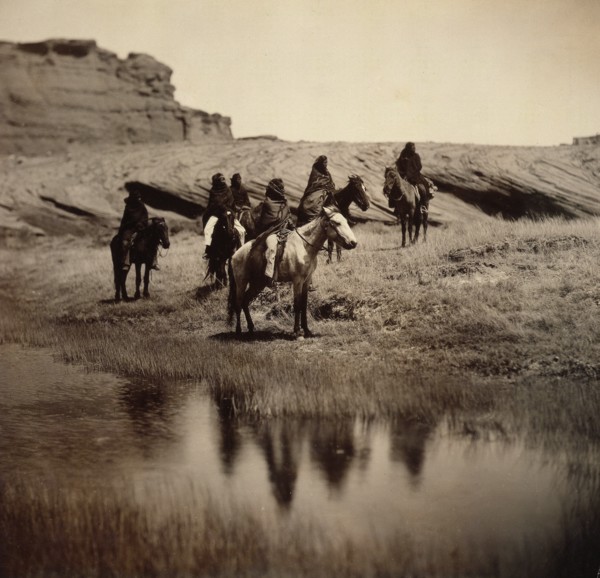 Edward S. Curits Native American Indians - Six Navajo on horseback, water in foreground circa 1904.