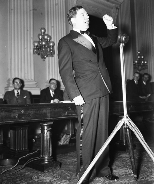 Senator Huey P. Long speaking in early 1935 .