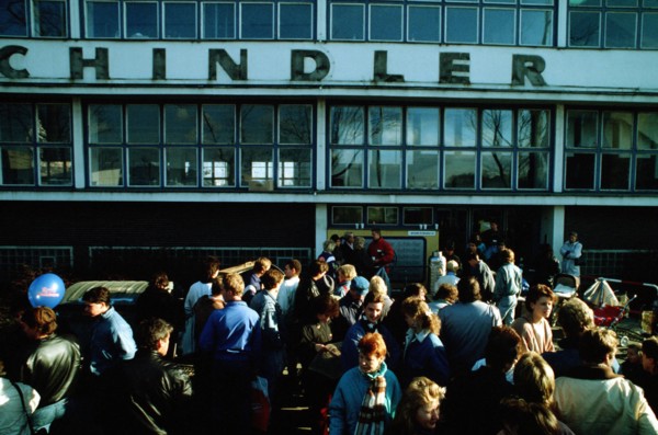 A crowd of East German refugees gathers outside the refugee center in West Berlin..