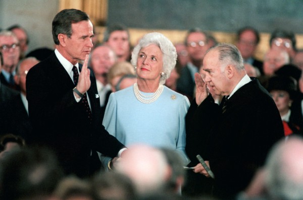 1/21/1985 - Associate Justice of the U.S. Supreme Court Potter Stewart administers Vice President George Bush's second oath of office in the Capital rotunda as Mrs. Bush looks on