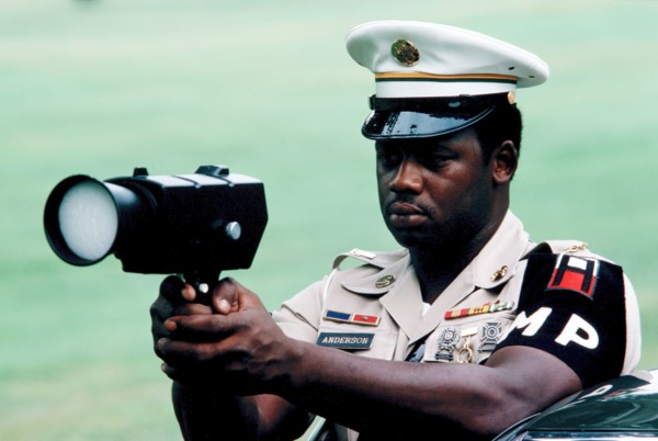 US Army military policeman uses radar speed detection equipment.