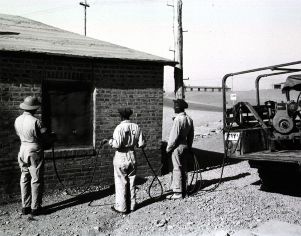 A malaria control detachment sprays billets at Amirabad Post