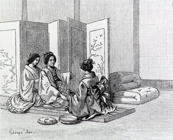 Two Japanese women attend to a woman in labor.