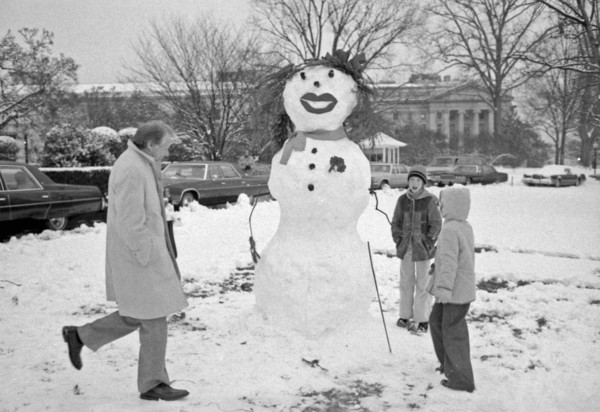 President Carter views snowman built by Amy Carter and her friends.