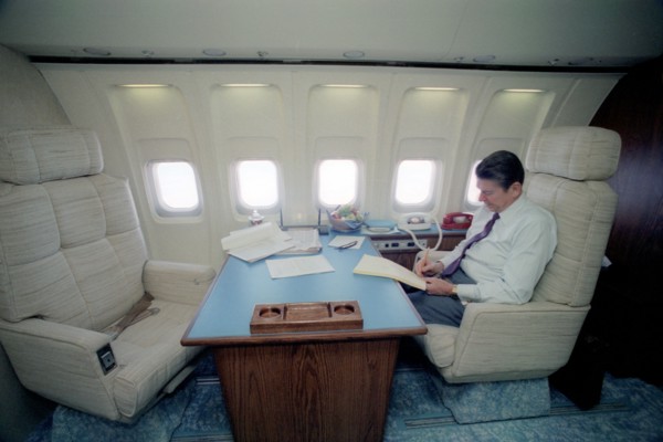 President Reagan working in his Air Force One state room.