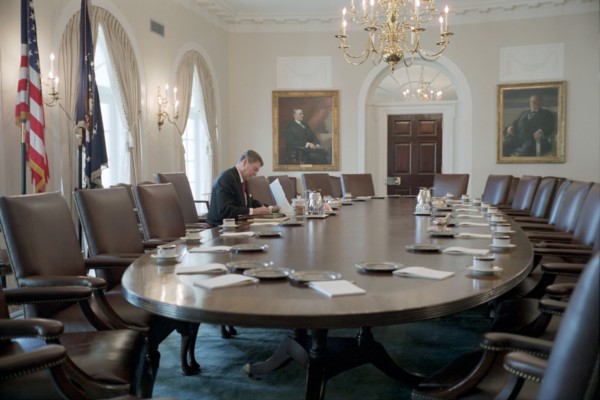 President Reagan working in the White House Cabinet Room.