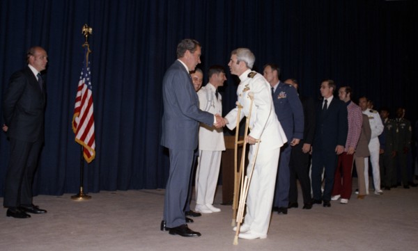 John McCain greeted by Richard Nixon.