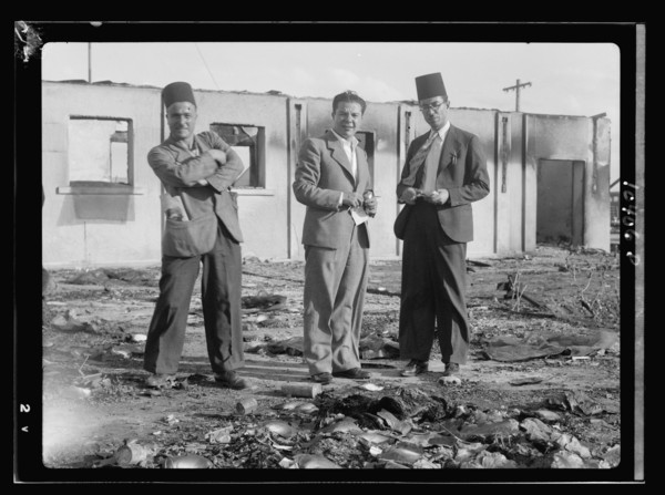 Jacob Simon in Lydda, holding a note pad, interviewing Ethiopian consul ca. between 1934 and 1939