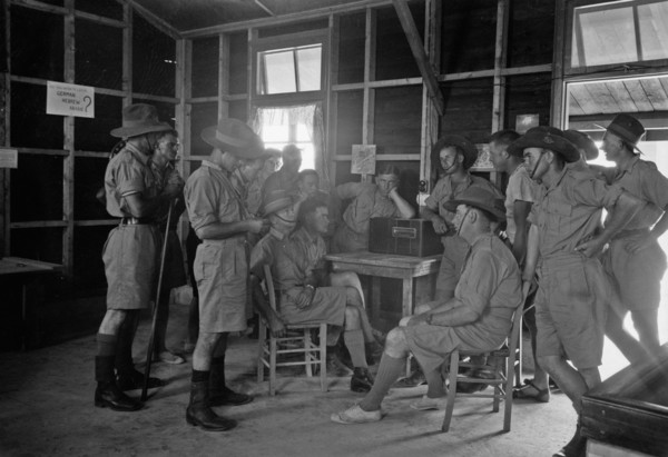 Australian Army Y.M.C.A. in Julis Camp. Group of Australian soldiers listening to the radio ca. between 1940 and 1946